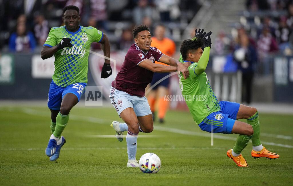 David Zalubowski Colorado Rapids forward Jonathan Lewis, center, pursues the ball with Seattle Sounders defenders Yeimar Gómez, left, and Xavier Arreaga in the second half of an MLS soccer match, Sunday, May 22 2022, in Commerce City, Colo. (AP Photo/David Zalubowski)