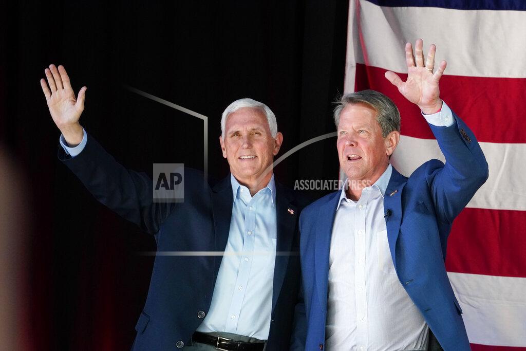 Brynn Anderson Former Vice President Mike Pence, left, and Georgia Gov. Brian Kemp greet the crowd during a rally, Monday, May 23, 2022, in Kennesaw, Ga. Pence is opposing former President Donald Trump and his preferred Republican candidate for Georgia governor, former U.S. Sen. David Perdue. (AP Photo/Brynn Anderson)
