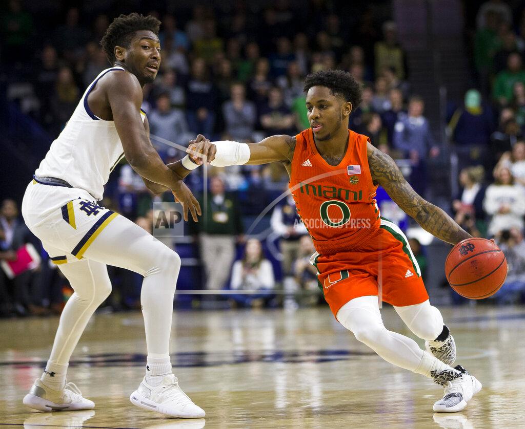 Robert Franklin FILE - In this Feb. 23, 2020, file photo, Miami's Chris Lykes (0) drives around Notre Dame's Temple 'T.J.' Gibbs during the first half of an NCAA college basketball game in South Bend, Ind. Lykes says several of his teammates are versatile enough for the Hurricanes to mix and match on the perimeter. “It will be a different team defensively, and better, too,” Lykes says. “We have solid rim protection. We've also got guys who can guard a number of different positions. We have been picking up full court in practice, and I think we have the speed and agility to do that.” (AP Photo/Robert Franklin, File)