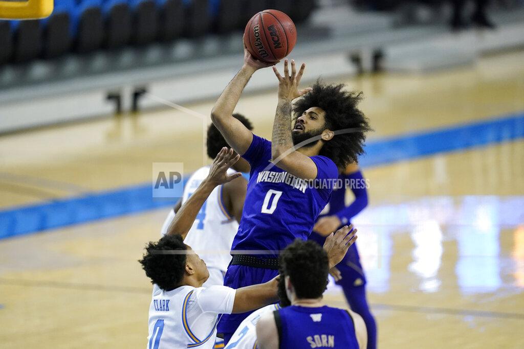 Ashley Landis Washington guard Marcus Tsohonis (0) takes a shot against UCLA guard Jaylen Clark (0) during the first half of an NCAA college basketball game Saturday, Jan. 16, 2021, in Los Angeles. (AP Photo/Ashley Landis)