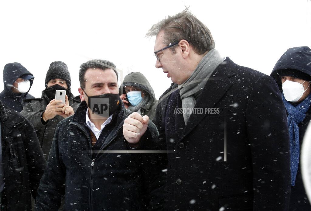 Boris Grdanoski Serbia's President Aleksandar Vucic, right, talks with North Macedonia's Prime Minister Zoran Zaev, left, upon their meeting at the border crossing Tabanovce, between North Macedonia and Serbia, on Sunday, Feb. 14, 2021. Serbia which has launched a successful vaccination campaign has donated some 8,000 doses of Pfizer COVID-19 shots to North Macedonia which is yet to deliver its first shots. (AP Photo/Boris Grdanoski)