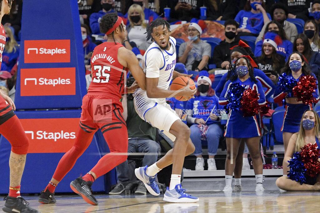Mark Black DePaul's Nick Ongenda (14) works to get past Rutgers' Ralph Gonzales-Agee (35) during the first half of an NCAA college basketball game Thursday, Nov. 18, 2021, in Chicago. (AP Photo/Mark Black)