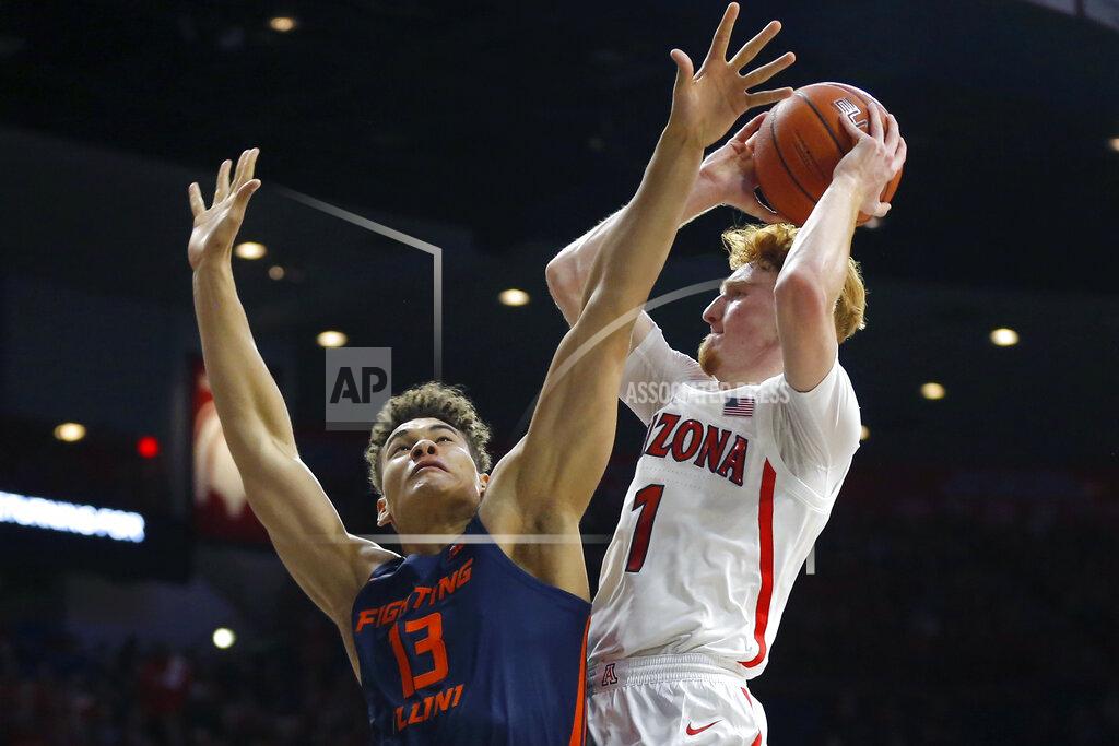 Rick Scuteri Illinois forward Benjamin Bosmans-Verdonk (13) defends against Arizona guard Nico Mannion during the second half of an NCAA college basketball game Sunday, Nov. 10, 2019, in Tucson, Ariz. Arizona defeated Illinois 90-69. (AP Photo/Rick Scuteri)