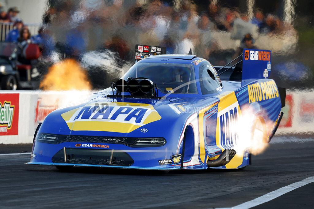Randy Anderson In this photo provided by the NHRA, Ron Capps drives in Funny Car qualifying Friday, April 22, 2022, during the NHRA SpringNationals drag races at Houston Raceway Park in Baytown, Texas. (Randy Anderson/)NHRA via AP)