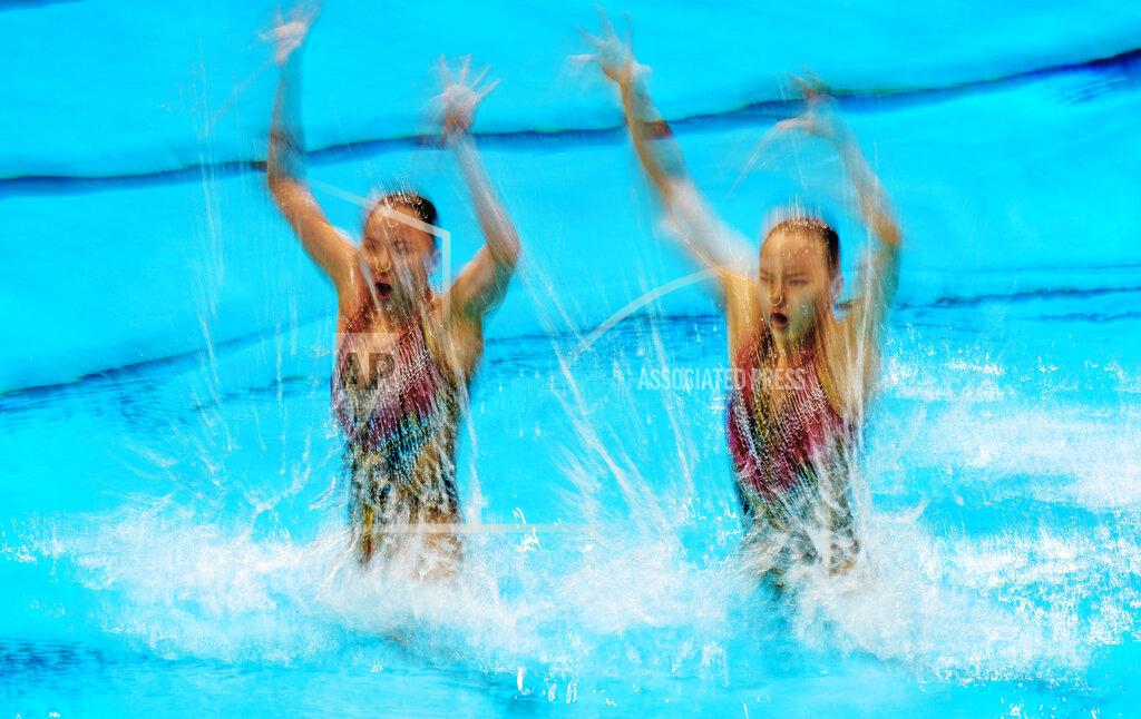 Dmitri Lovetsky Huang Xuechen and Sun Wenyan of China compete in the duet technical routine at the the 2020 Summer Olympics, Tuesday, Aug. 3, 2021, in Tokyo, Japan. (AP Photo/Dmitri Lovetsky)