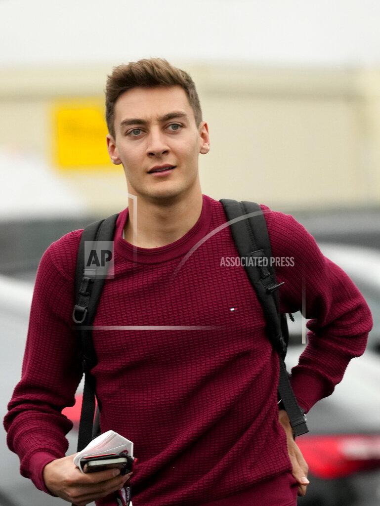 Luca Bruno Mercedes driver George Russell of Britain walks in the paddock at the Dino and Enzo Ferrari racetrack, in Imola, Italy, Thursday, April 21, 2022. Italy's Emila Romagna Formula One Grand Prix will take place on Sunday. (AP Photo/Luca Bruno)