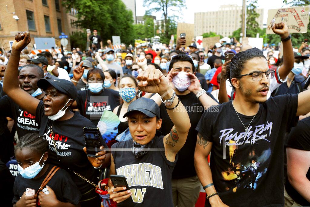 Julio Cortez People gather outside Frank J. Lindquist Sanctuary at North Central University after a memorial service for George Floyd Thursday, June 4, 2020, in Minneapolis. (AP Photo/Julio Cortez)