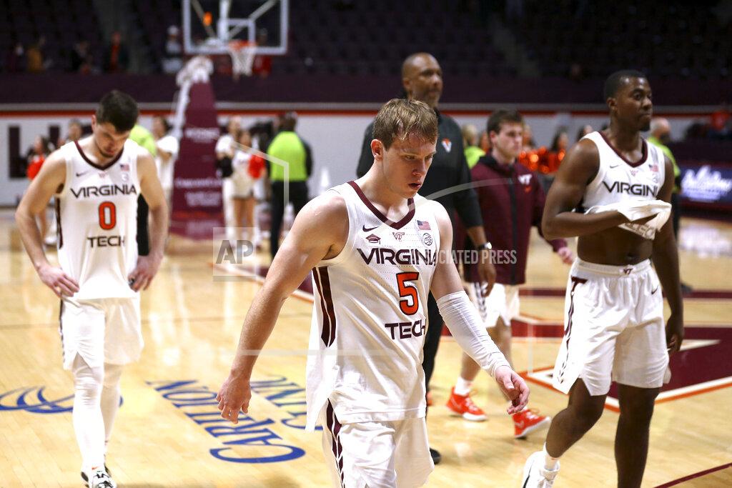 Matt Gentry Virginia Tech's Hunter Cattoor (0), Storm Murphy (5) and Nahiem Alleyne leave the floor after the team's NCAA college basketball game against North Carolina State on Tuesday, Jan. 4, 2022, in Blacksburg, Va. (Matt Gentry/The Roanoke Times via AP)