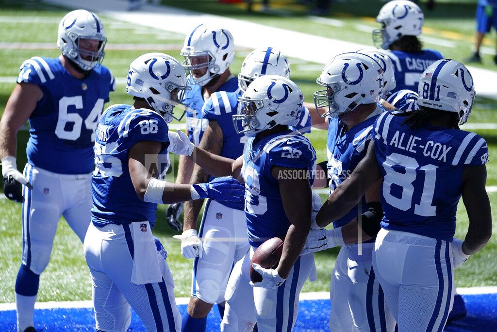 Michael Conroy Indianapolis Colts' Jonathan Taylor (28) celebrates with Noah Togiai (86) after running for a touchdown during the first half of an NFL football game, Sunday, Sept. 20, 2020, in Indianapolis. (AP Photo/Michael Conroy)