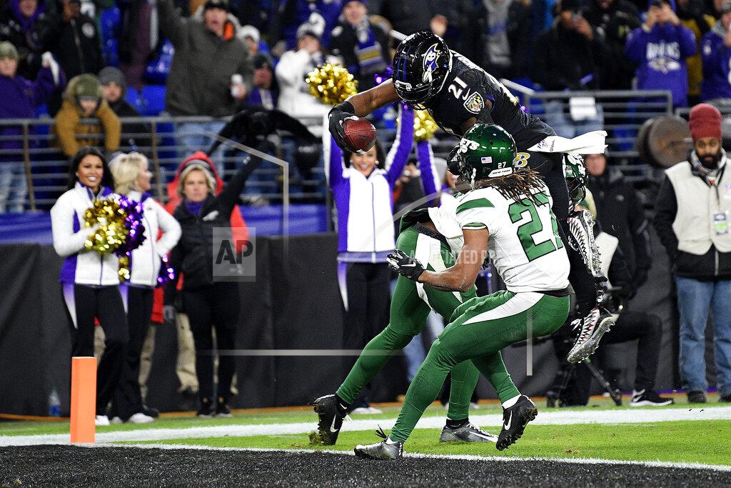 Nick Wass Baltimore Ravens running back Mark Ingram (21) dives over New York Jets free safety Marcus Maye and cornerback Darryl Roberts (27) for a touchdown during the second half of an NFL football game, Thursday, Dec. 12, 2019, in Baltimore. (AP Photo/Nick Wass)