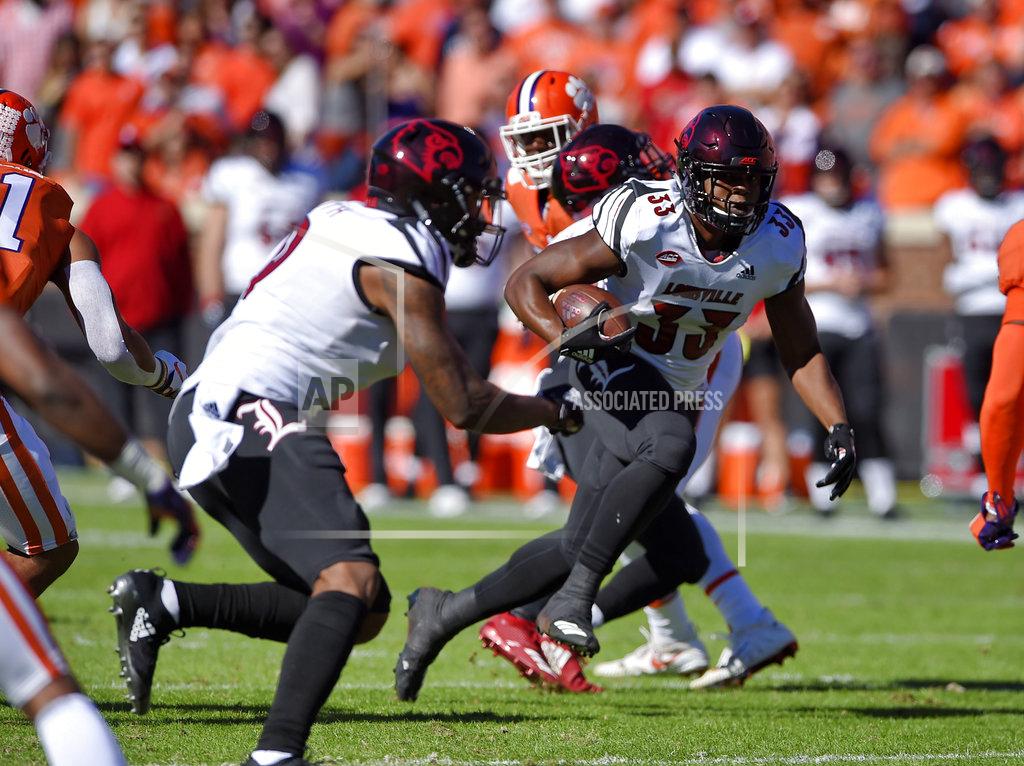 Richard Shiro Louisville's Colin Wilson rushes during the first half of an NCAA college football game against Clemson, Saturday, Nov. 3, 2018, in Clemson, S.C. (AP Photo/Richard Shiro)