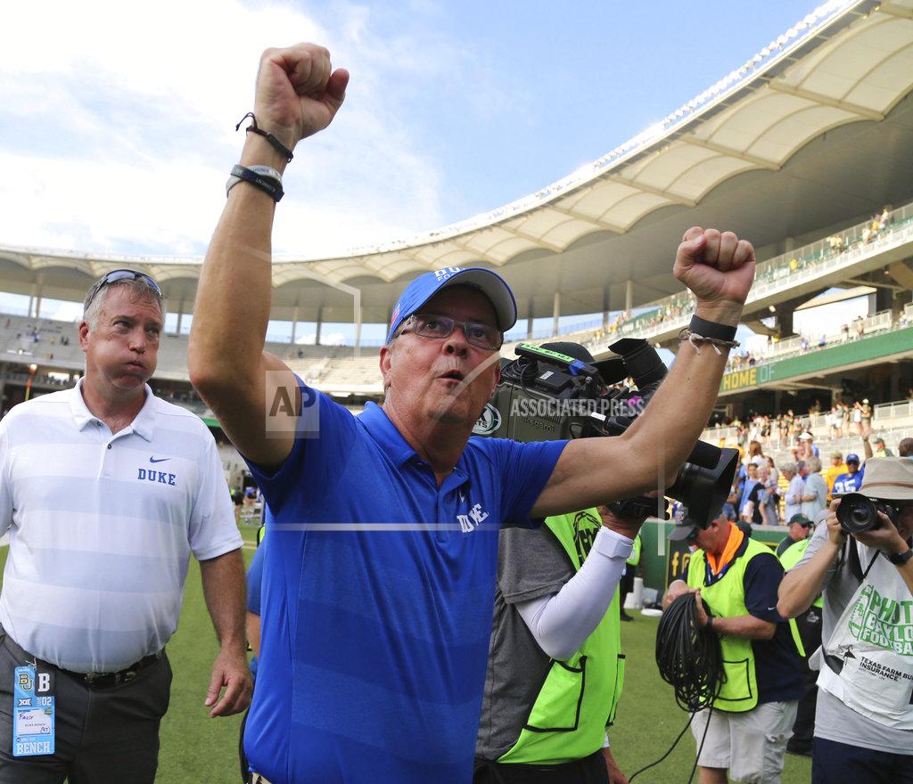 Rod Aydelotte FILE - In this Sept. 15, 2018, file photo, Duke head football coach David Cutcliffe celebrates after a 40-27 win over Baylor in an NCAA college football game, in Waco, Texas. Major college football teams are on a record scoring pace this season and a more aggressive approach on fourth down is helping to fuel the surge. (Rod Aydelotte/Waco Tribune-Herald via AP, File)