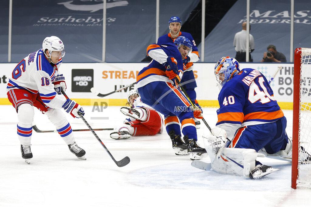 Jason Decrow New York Islanders goalie Semyon Varlamov (40), of Russia, saves a shot from New York Rangers' Ryan Strome (16) during the third period of an NHL hockey game Friday, April 9, 2021, in Uniondale, N.Y. (AP Photo/Jason DeCrow)