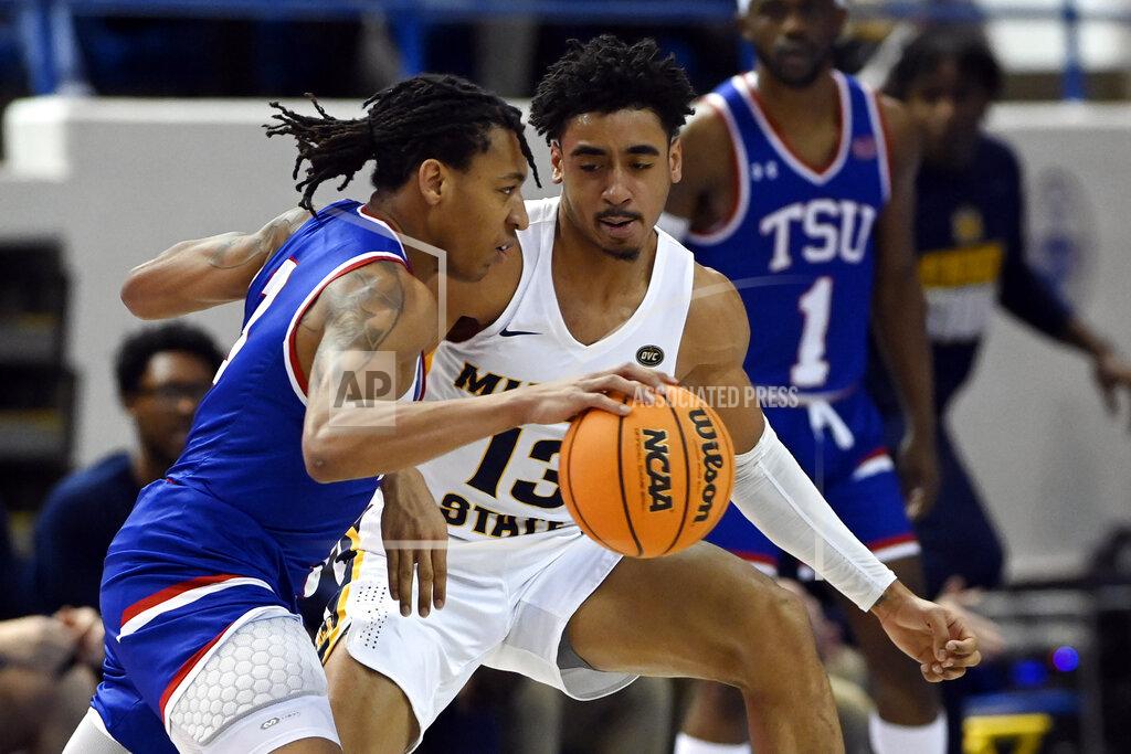 Mark Zaleski Tennessee State guard Tajik Bartholomew (3) is defended by Murray State guard Carter Collins (13) during the first half of an NCAA college basketball game Thursday, Feb. 10, 2022, in Nashville, Tenn. (AP Photo/Mark Zaleski)