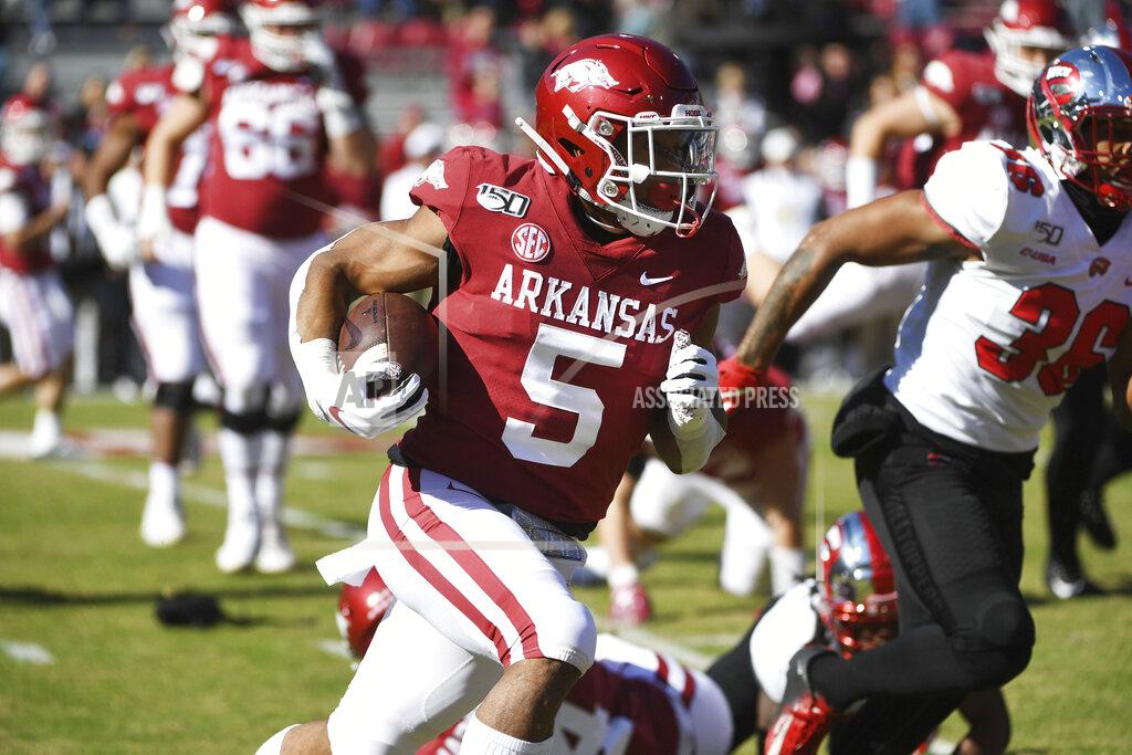 Michael Woods FILE - In this Nov. 9, 2019, file photo, Arkansas running back Rakeem Boyd (5) runs the ball against Western Kentucky during the second half of an NCAA college football game in Fayetteville, Ark. Boyd ran for 1,133 yards and eight scores as a junior last season while rushing for more than 100 yards in five games. (AP Photo/Michael Woods)