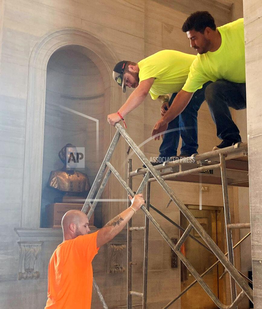 Kimberlee Kruesi Workers prepare scaffolding in front of a bust of Confederate general and early Ku Klux Klan leader Nathan Bedford Forrest at the State Capitol, Thursday, July 22, 2021, in Nashville, Tenn. A decades-long effort to remove the bust from the Tennessee Capitol cleared its final hurdle Thursday, with state leaders approving the final vote needed to allow the statue to be relocated to a museum. (AP Photo/Kimberlee Kruesi)