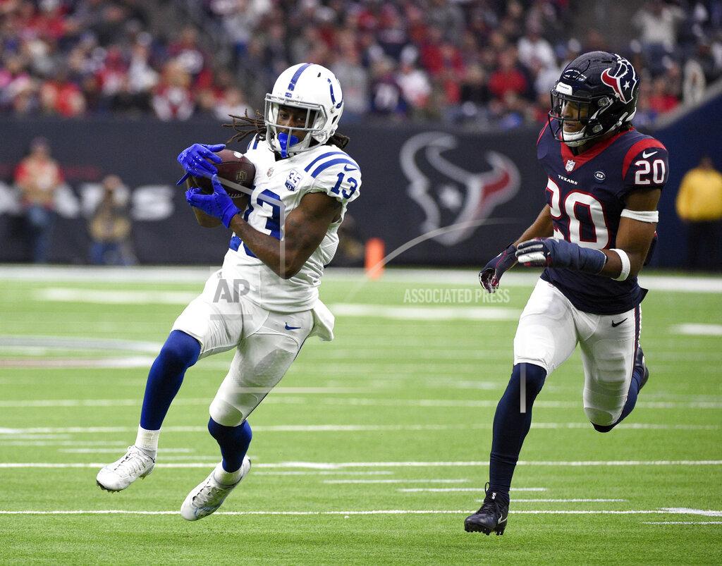 Eric Christian Smith FILE - In this Dec. 9, 2018, file photo, Indianapolis Colts wide receiver T.Y. Hilton (13) catches a pass for a first down as Houston Texans strong safety Justin Reid (20) defends during the first half of an NFL football game, in Houston. The Colts-Chiefs playoff game Saturday, Jan. 12, 2019, is hardly short of offensive firepower, extending far beyond star quarterbacks Andrew Luck and Patrick Mahomes. (AP Photo/Eric Christian Smith, File)