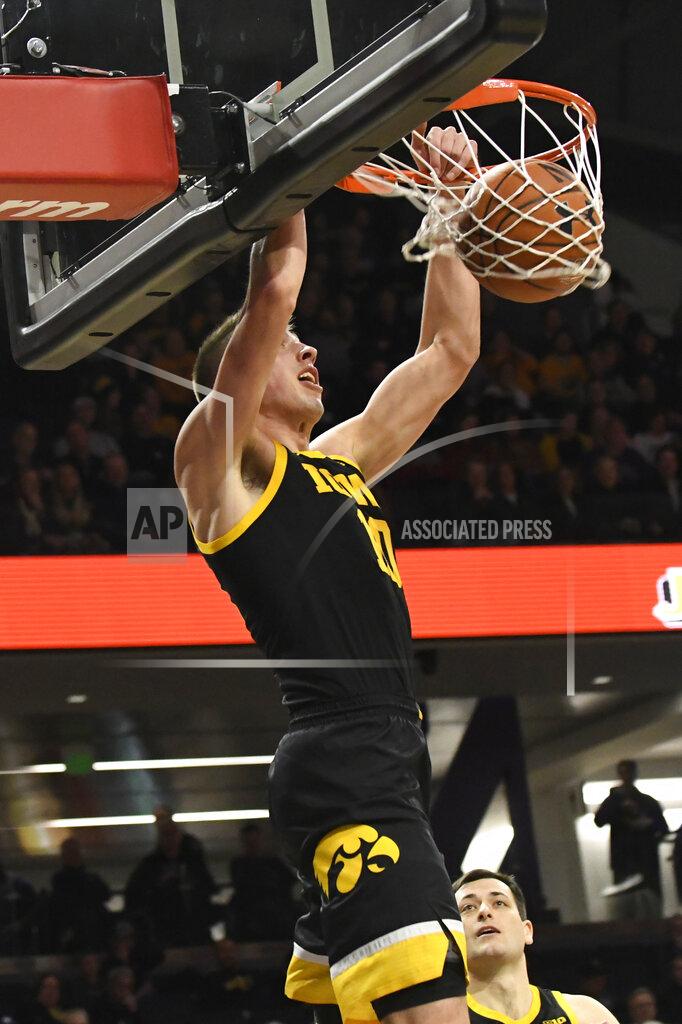 David Banks Iowa guard Joe Wieskamp dunks against Northwestern during the first half of an NCAA college basketball game Tuesday, Jan. 14, 2020, in Evanston, Ill. (AP Photo/David Banks)