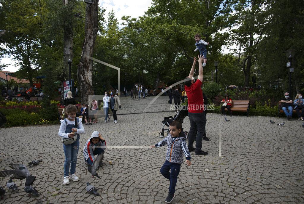 Burhan Ozbilici People visit Kugulu public garden, in Ankara, Turkey, Wednesday, June 3, 2020, days after the government lifted a series of restrictions imposed to fight the coronavirus pandemic. People crowded popular streets and parks while restaurants and cafes welcomed sit-in customers and beaches and museums reopened as part of Turkey's broadest easing of coronavirus restrictions.(AP Photo/Burhan Ozbilici)