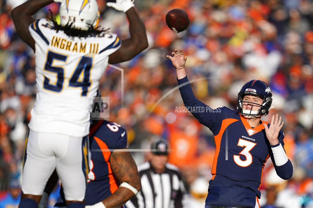 Jack Dempsey Denver Broncos quarterback Drew Lock passes under pressure form Los Angeles Chargers defensive end Melvin Ingram during the first half of an NFL football game Sunday, Dec. 1, 2019, in Denver. (AP Photo/Jack Dempsey)