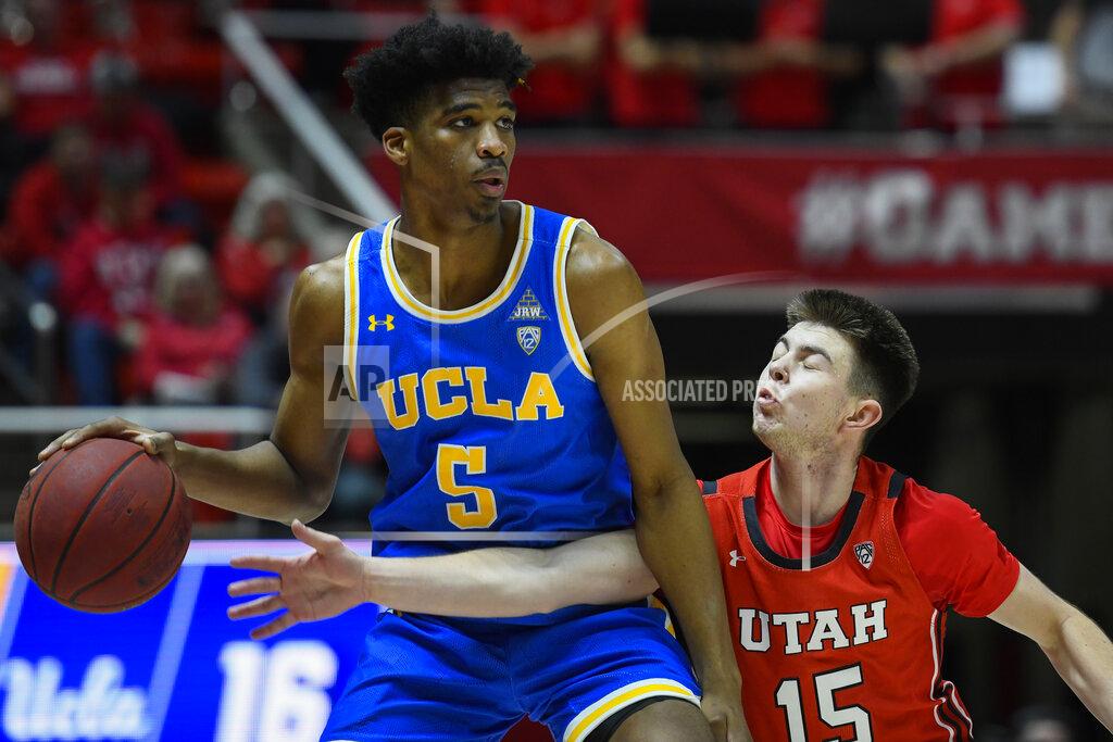 Alex Goodlett UCLA guard Chris Smith (5) attempts to dribble around Utah guard Rylan Jones (15) during the first half of an NCAA college basketball game Thursday, Feb. 20, 2020, in Salt Lake City. (AP Photo/Alex Goodlett)