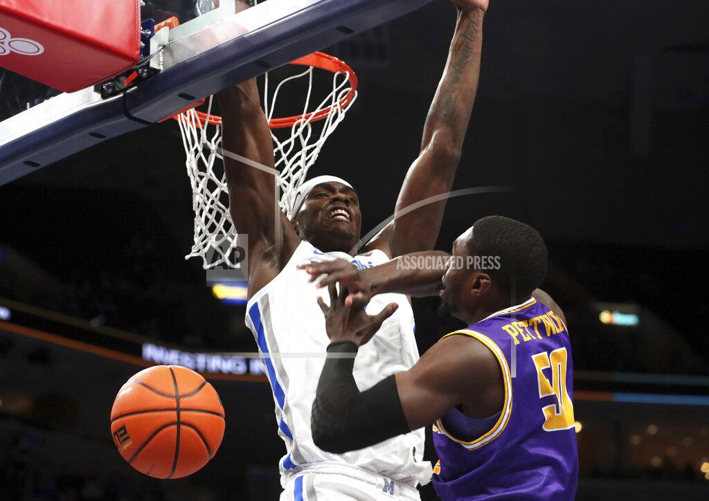 Karen Pulfer Focht Memphis Jalen Duren, top, blocks a shot against Tennessee Tech's John Pettway in the first half of an NCAA college basketball game Tuesday, Nov. 9, 2021, in Memphis, Tenn. (AP Photo/Karen Pulfer Focht)