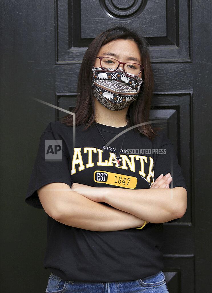 Claire Xu, poses for a photo, Friday, April 9, 2021, in Decatur, Ga., Xu was propelled into action following the mass fatal shootings of eight people, six of them Asian women, at a Georgia massage businesses in March. She organized a massive rally condemning violence against Asian Americans that drew support from a broad group of activists, elected officials and community members. But her own parents were opposed. (AP Photo/Akili-Casundria Ramsess)