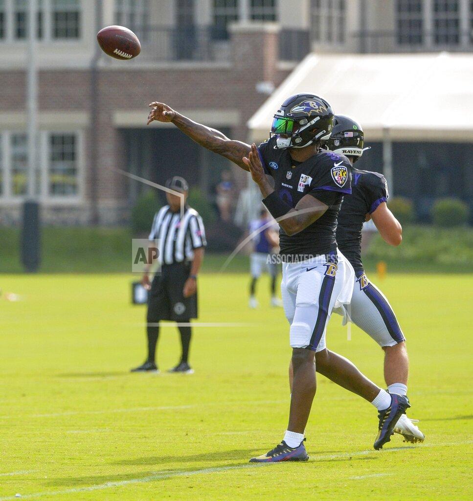 Kevin Richardson Baltimore Ravens quarterback Lamar Jackson returns to football practice after missing 10-days due to COVID-19. He completes a pass during training camp at Under Armour Performance Center on Aug. 7, 2021 in Owings Mills, Md. (Kevin Richardson/The Baltimore Sun via AP)