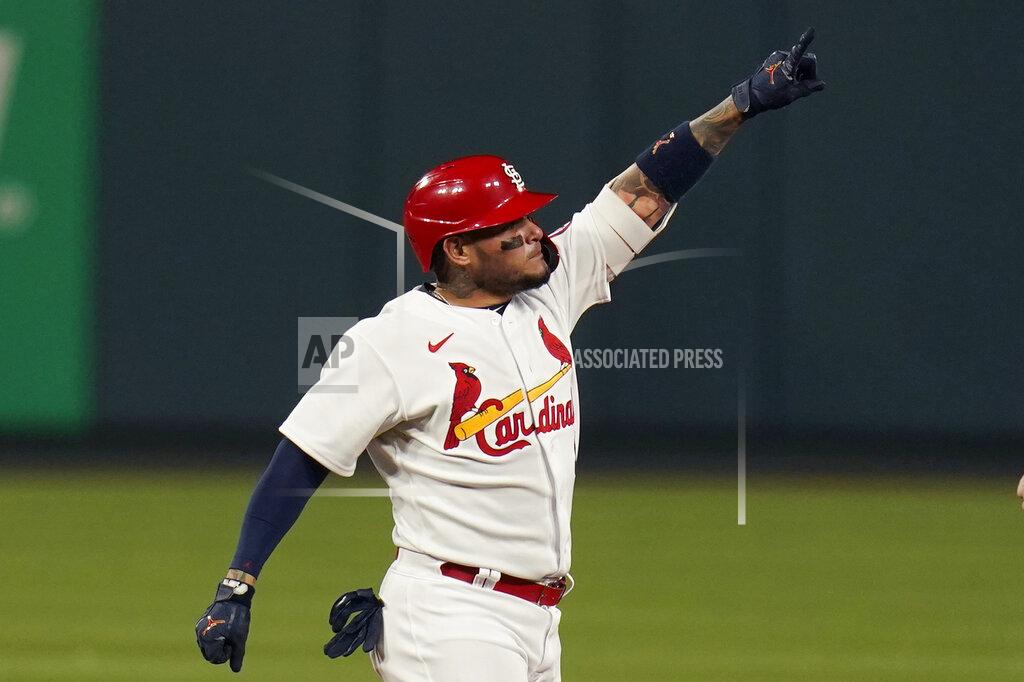 Jeff Roberson St. Louis Cardinals' Yadier Molina celebrates after hitting an RBI double during the third inning of a baseball game against the Cincinnati Reds Friday, April 23, 2021, in St. Louis. (AP Photo/Jeff Roberson)