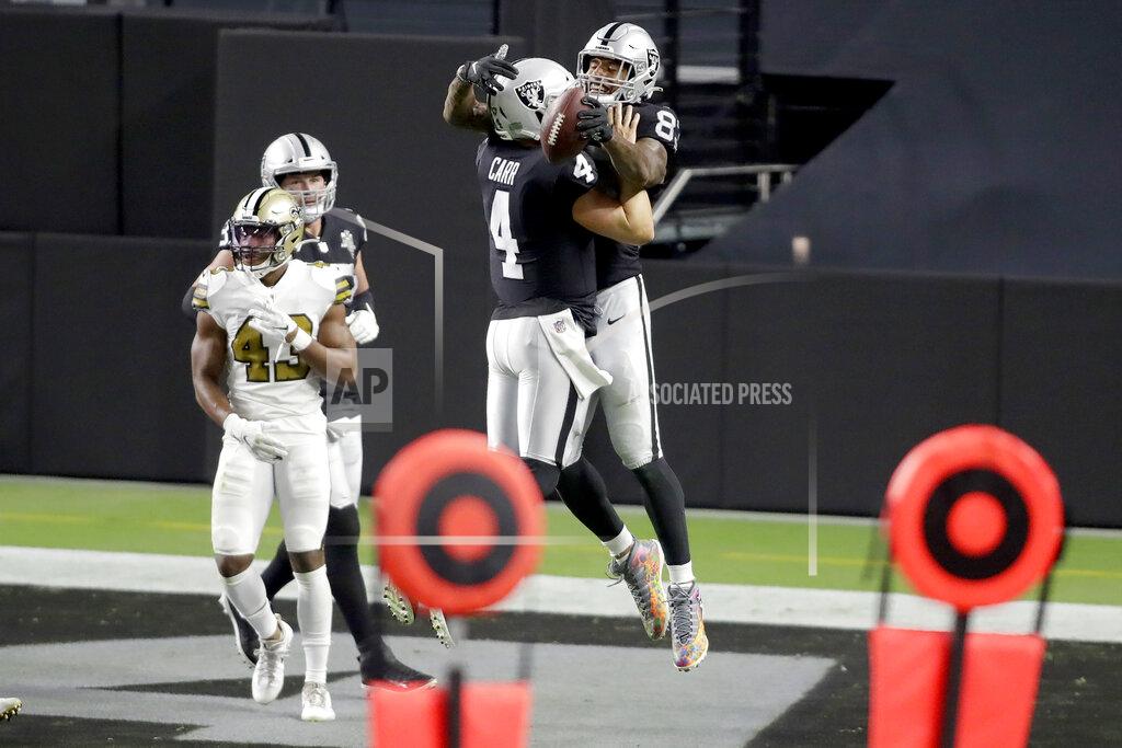 Isaac Brekken Las Vegas Raiders quarterback Derek Carr (4) celebrates after throwing a touchdown pass to tight end Darren Waller (83) during the second half of an NFL football game, Monday, Sept. 21, 2020, in Las Vegas. (AP Photo/Isaac Brekken)