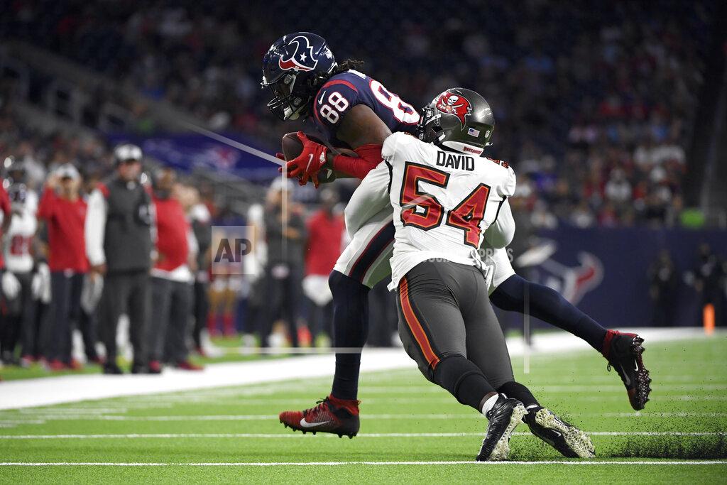 Justin Rex Houston Texans tight end Jordan Akins (88) is tackled by Tampa Bay Buccaneers outside linebacker Lavonte David (54) during the first half of an NFL preseason football game Saturday, Aug. 28, 2021, in Houston. (AP Photo/Justin Rex)