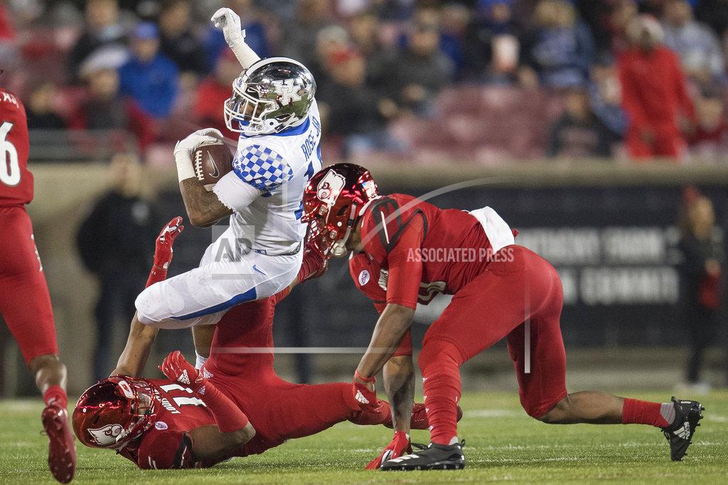 Bryan Woolston Kentucky running back Asim Rose (10) is tackled by Louisville safety Dee Smith (11) during the second half of an NCAA college football game in Louisville, Ky., Saturday, Nov. 24, 2018. (AP Photo/Bryan Woolston)