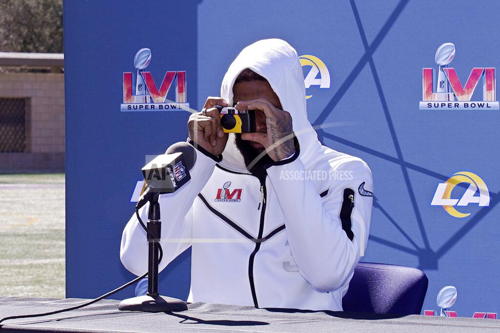 Mark J. Terrill Los Angeles Rams wide receiver Odell Beckham Jr. takes a picture of the media during a media availability for an NFL Super Bowl football game Friday, Feb. 11, 2022, in Thousand Oaks, Calif. The Rams are scheduled to play the Cincinnati Bengals in the Super Bowl on Sunday. (AP Photo/Mark J. Terrill)