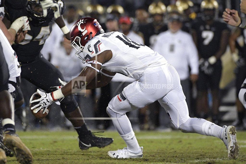 Phelan M. Ebenhack Cincinnati running back Charles McClelland (10) fumbles the ball during the second half of an NCAA college football game against Central Florida, Saturday, Nov. 17, 2018, in Orlando, Fla. Central Florida won, 38-13. (AP Photo/Phelan M. Ebenhack)