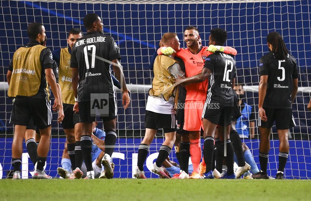 Franck Fife Lyon players celebrate after winning the Champions League quarterfinal match against Manchester City at the Jose Alvalade stadium in Lisbon, Portugal, Saturday, Aug. 15, 2020. (Franck Fife/Pool Photo via AP)