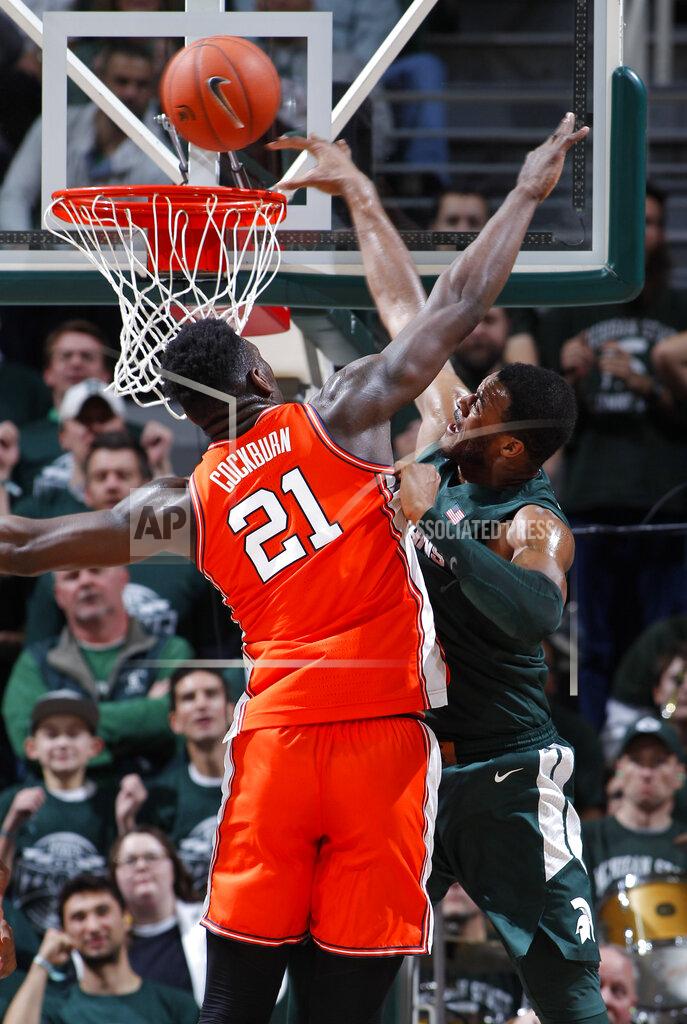 Al Goldis Michigan State's Xavier Tillman, right, attempts to dunk against Illinois' Kofi Cockburn (21) during the first half of an NCAA college basketball game Thursday, Jan. 2, 2020, in East Lansing, Mich. (AP Photo/Al Goldis)