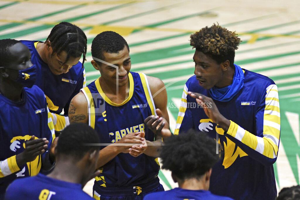 Gaston De Cardenas Carver College huddles before their game against Florida International Monday, Dec. 21, 2020, in Miami. (AP Photo/Gaston De Cardenas)