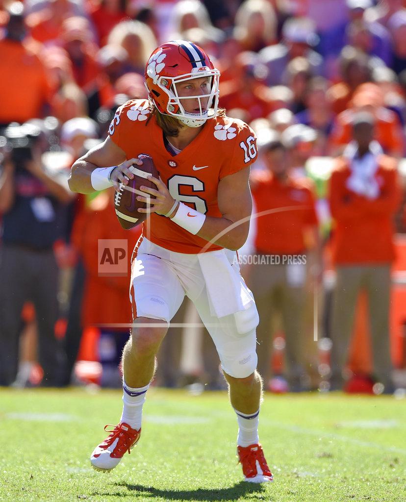 Richard Shiro Clemson quarterback Trevor Lawrence scrambles out of the pocket during the first half of an NCAA college football game against Louisville, Saturday, Nov. 3, 2018, in Clemson, S.C. (AP Photo/Richard Shiro)