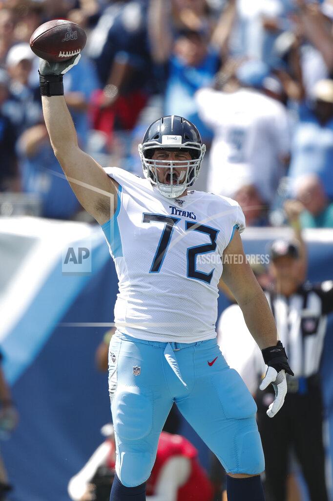 Wade Payne Tennessee Titans' David Quessenberry (72) celebrates after catching a touchdown pass against the Indianapolis Colts in the first half of an NFL football game Sunday, Sept. 15, 2019, in Nashville, Tenn. (AP Photo/Wade Payne)