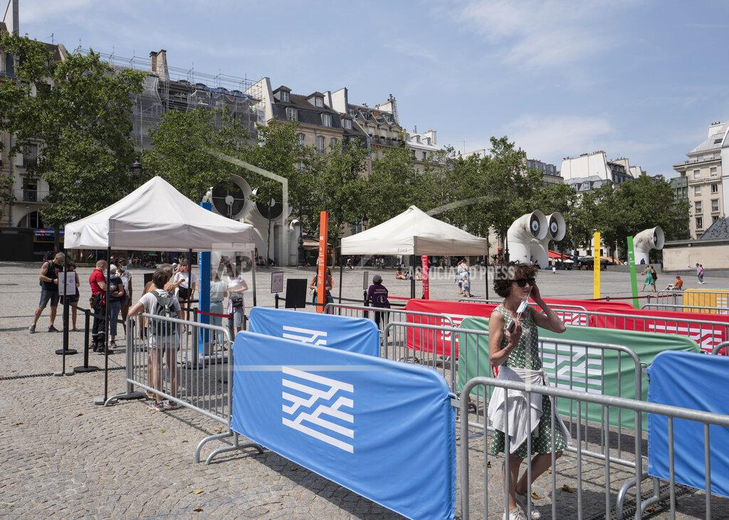 Rafael Yaghobzadeh Visitors enter after registering for COVID-19 tests at the Georges Pompidou museum in Paris, Friday, July 23, 2021. Visitors now need a special COVID pass to visit French museums or movie theaters, the first step in a new campaign against what the government calls a "stratospheric" rise in delta variant infections. (AP Photo/Rafael Yaghobzadeh)