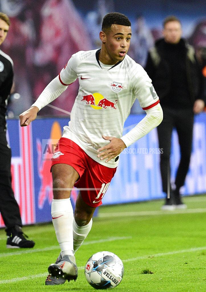 FILE - In this Saturday, Dec. 21, 2019 file photo Leipzig's Tyler Adams controls the ball during the German Bundesliga soccer match between RB Leipzig and FC Augsburg in Leipzig, Germany. (AP Photo/Jens Meyer, file)