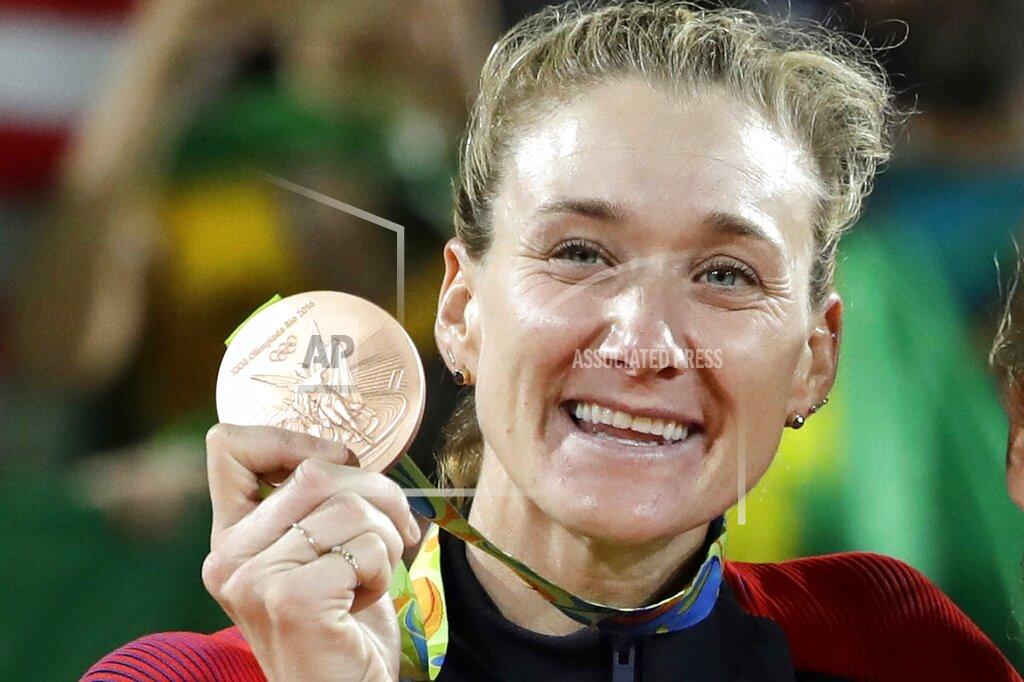 Marcio Jose Sanchez FILE - In this Aug. 18, 2016, file photo, United States' Kerri Walsh Jennings stands on the podium after winning the bronze medal in the women's beach volleyball competition of the 2016 Summer Olympics in Rio de Janeiro, Brazil. The volleyball star created a virtual summer camp in 2020 for young volleyball players and others seeking to stay active during the coronavirus pandemic. (AP Photo/Marcio Jose Sanchez, File)