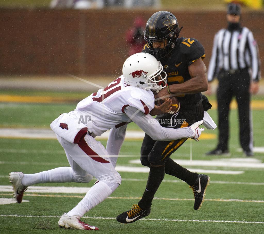 L.g. Patterson Missouri wide receiver Johnathon Johnson, right, is hit by Arkansas defensive back Montaric Brown, left, as he catches the ball during the first half of an NCAA college football game Friday, Nov. 23, 2018, in Columbia, Mo. (AP Photo/L.G. Patterson)