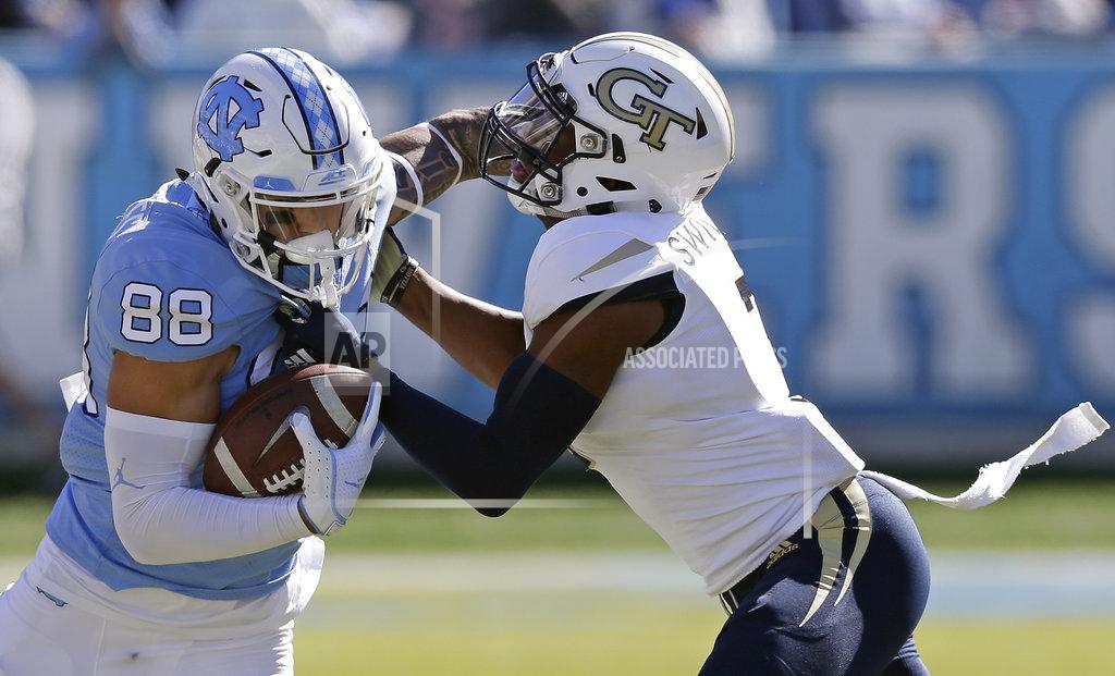 Gerry Broome North Carolina's Beau Corrales (88) runs the ball while Georgia Tech's Tre Swilling tackles during the first half of an NCAA college football game in Chapel Hill, N.C., Saturday, Nov. 3, 2018. (AP Photo/Gerry Broome)