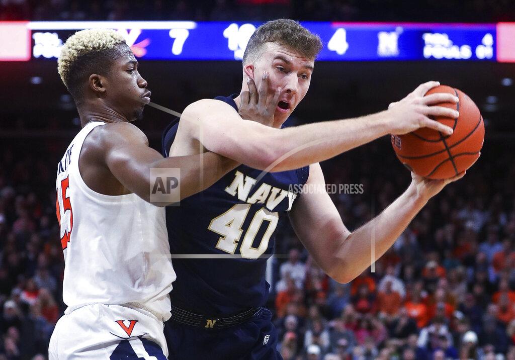 Andrew Shurtleff Navy center Evan Wieck (40) is defended by Virginia forward Mamadi Diakite (25) during an NCAA college basketball game in Charlottesville, Va., Sunday, Dec. 29, 2019. (AP Photo/Andrew Shurtleff)