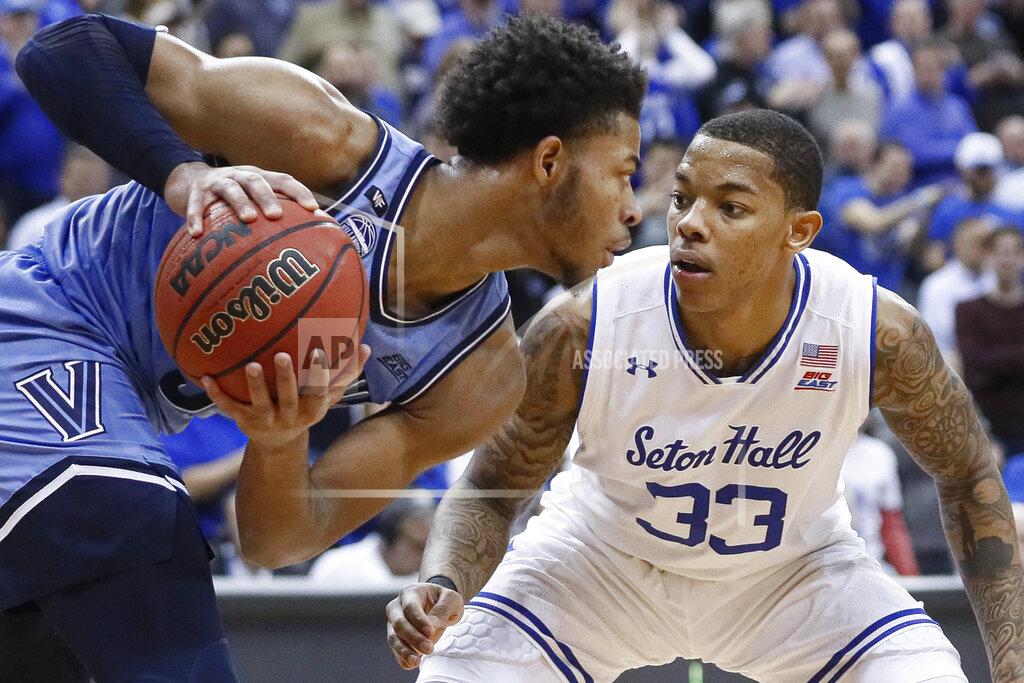 John Minchillo Seton Hall's Shavar Reynolds (33) faces off against Villanova's Justin Moore during the second half of an NCAA college basketball game Wednesday, March 4, 2020, in Newark, N.J. (AP Photo/John Minchillo)