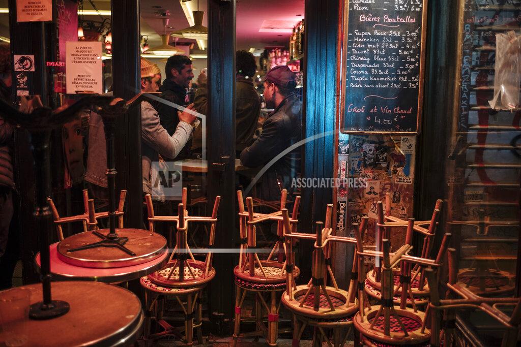 Lewis Joly People enjoy a drink on a bar terrace in Paris, Monday, Oct. 5, 2020. French authorities have placed the Paris region on maximum virus alert on Monday, banning festive gatherings and requiring all bars to close but allowing restaurants to remain open, as numbers of infections are rapidly increasing. (AP Photo/Lewis Joly)