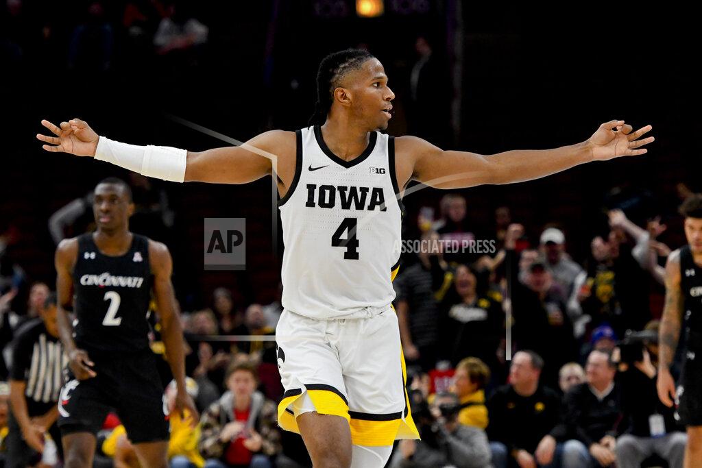 Matt Marton Iowa guard Bakari Evelyn reacts after scoring a 3-point basket against Cincinnati during the second half of an NCAA college basketball game Saturday, Dec. 21, 2019, in Chicago. (AP Photo/Matt Marton)