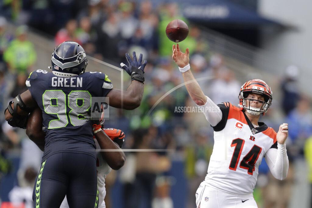 Stephen Brashear Cincinnati Bengals quarterback Andy Dalton (14) passes under pressure from Seattle Seahawks defensive end Rasheem Green (98) during the second half of an NFL football game Sunday, Sept. 8, 2019, in Seattle. (AP Photo/Stephen Brashear)