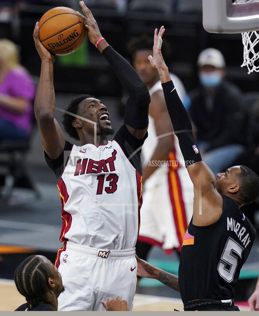 Eric Gay Miami Heat center Bam Adebayo (13) shoots over San Antonio Spurs guard Dejounte Murray (5) during the second half of an NBA basketball game in San Antonio, Wednesday, April 21, 2021. (AP Photo/Eric Gay)